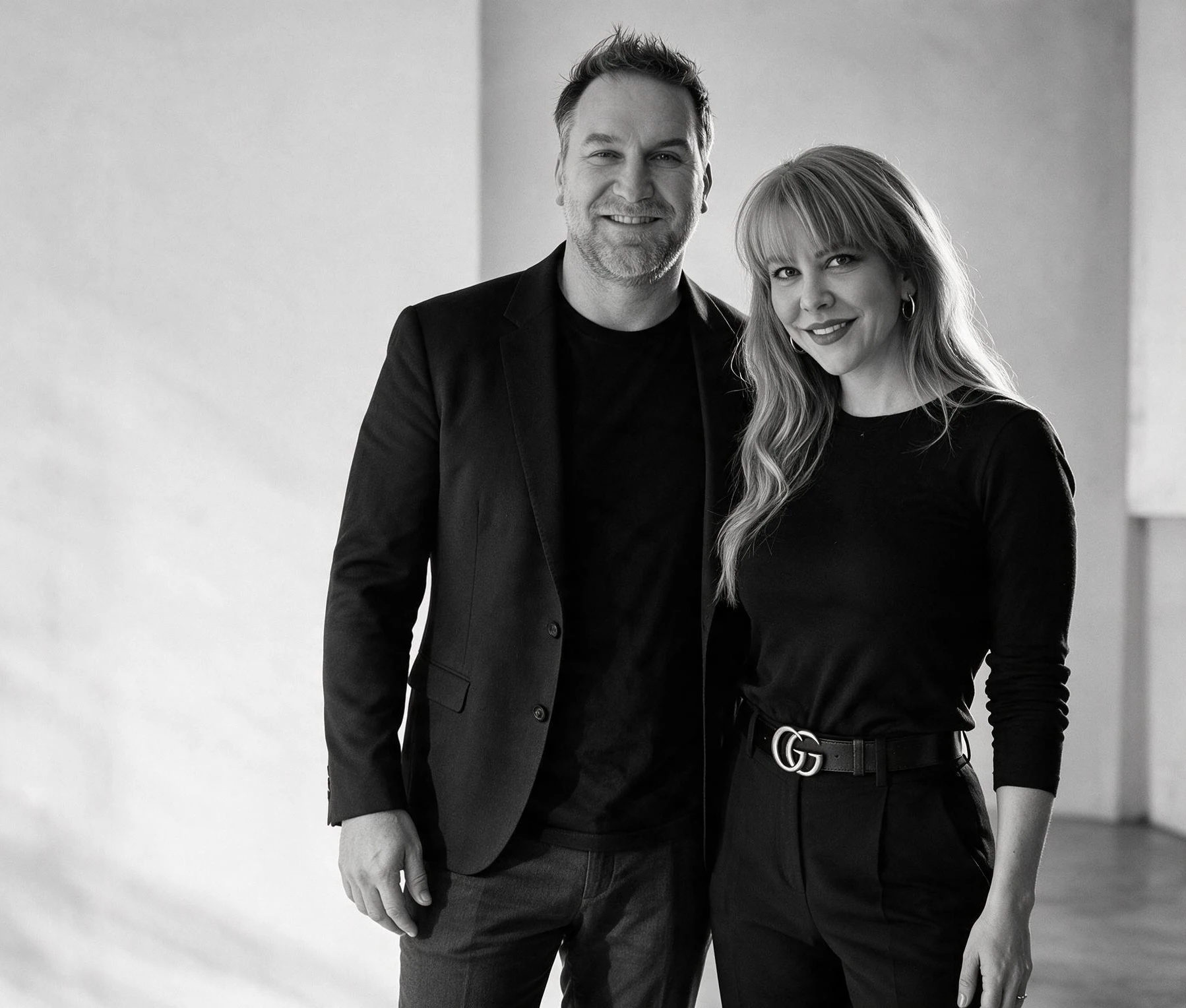 Summer and Randy Branam standing together in a monochrome portrait