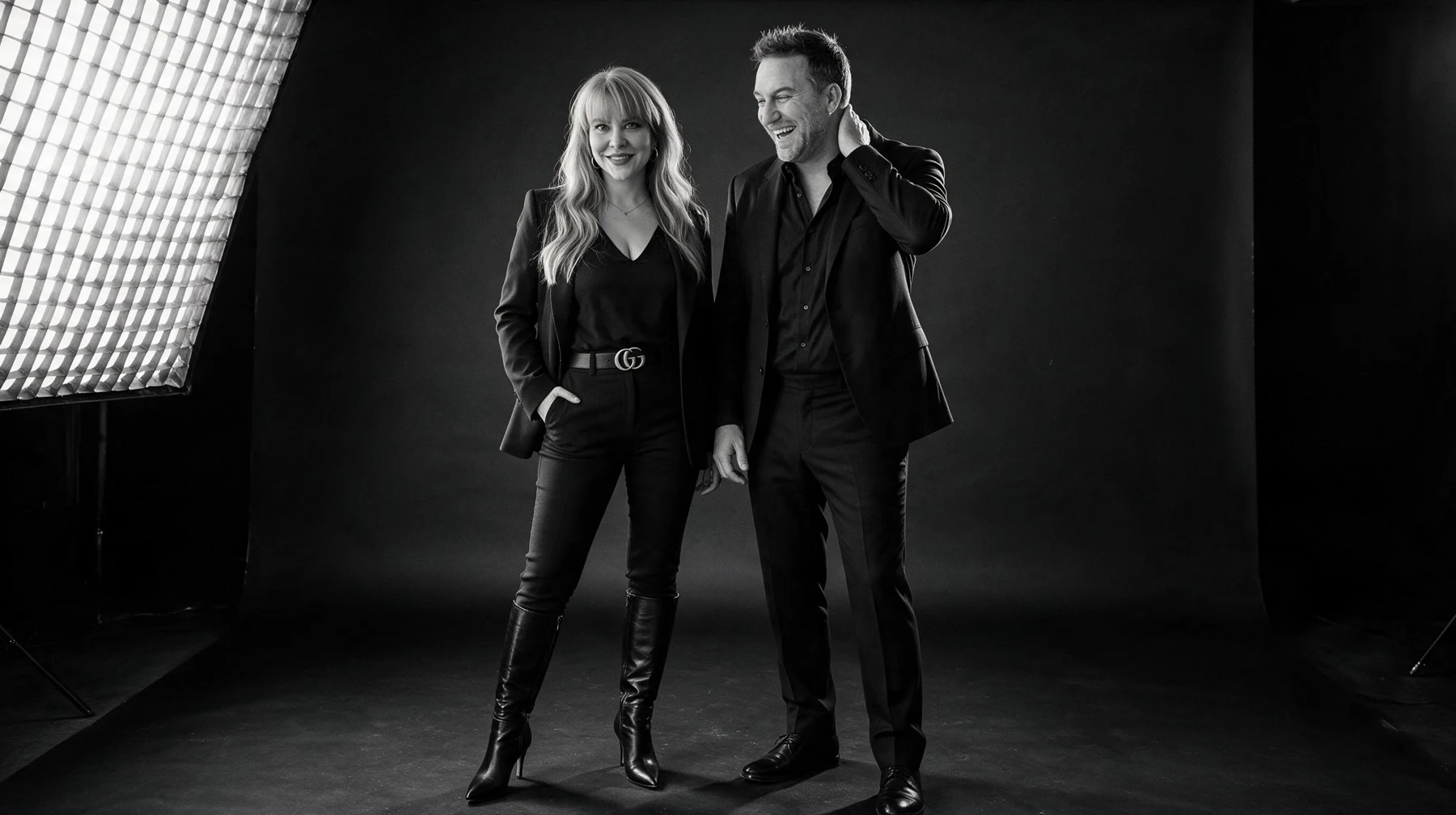 Summer and Randy Branam sharing a laugh during a monochrome studio photo session